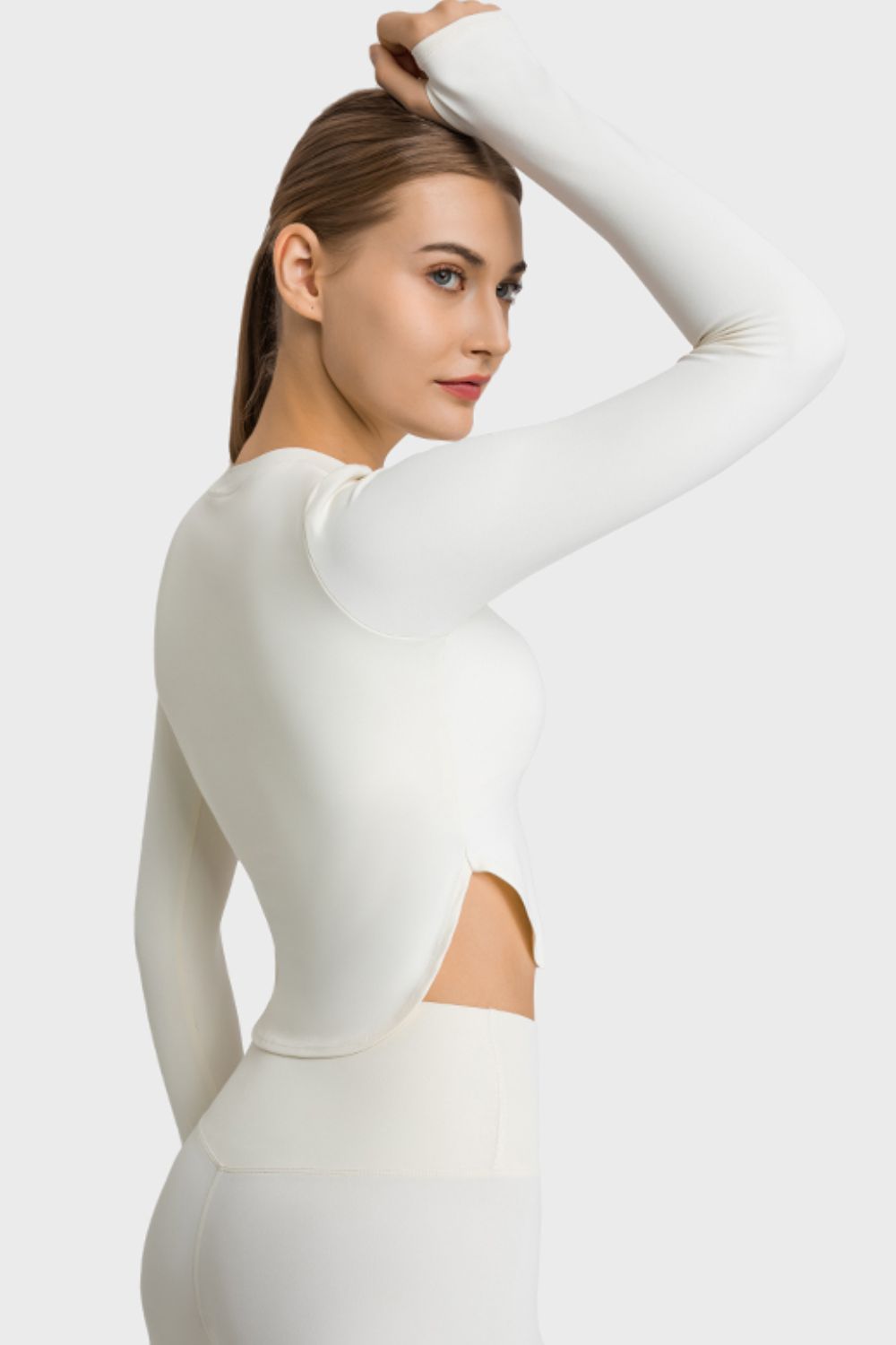 TrainTech Side Slit Long Sleeve Round Neck Crop Top - FleekGoddess